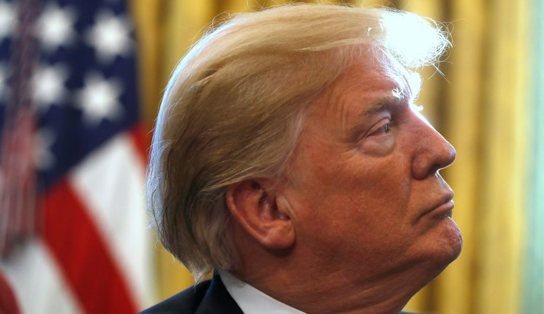 President Trump listens during a meeting with American manufacturers in the Oval Office of the White House, Thursday, Jan. 31, 2019, in Washington. Trump was signing an executive order pushing those who receive federal funds to "buy American." 