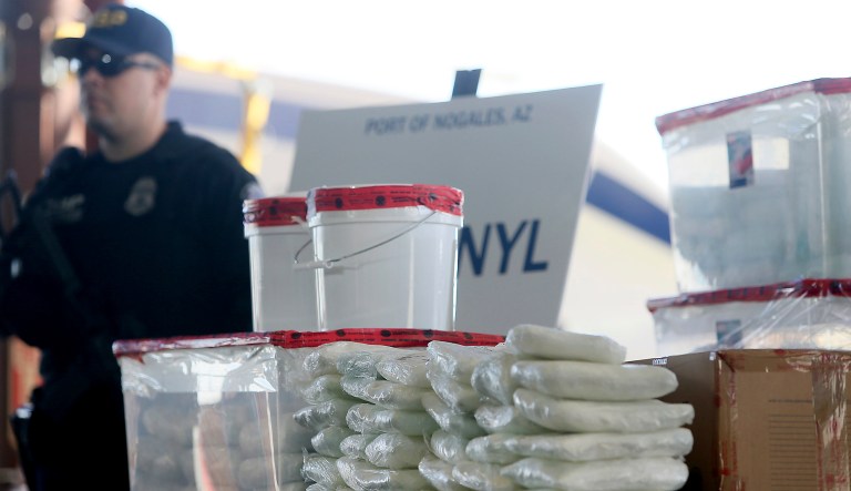 A display of the fentanyl and meth that was seized by Customs and Border Protection officers over the weekend at the Nogales Port of Entry is shown during a press conference Thursday, Jan. 31, 2019, in Nogales, Ariz.  U.S. Customs and Border Protection officials announced Thursday their biggest fentanyl bust ever, saying they captured nearly 254 pounds (114 kilograms) of the deadly synthetic opioid from a secret compartment inside a load of Mexican produce heading into Arizona. 