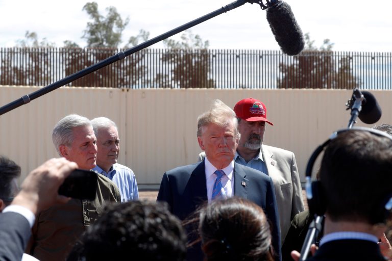 In this April 5, 2019, photo, President Donald Trump visits a new section of the border wall with Mexico in Calexico, Calif.