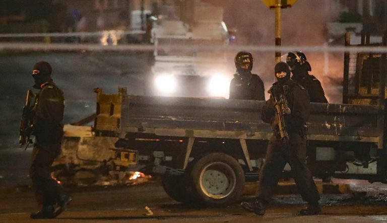 Police guard a crime scene during unrest in the Creggan area of Londonderry, in Northern Ireland, Thursday, April 18, 2019. 