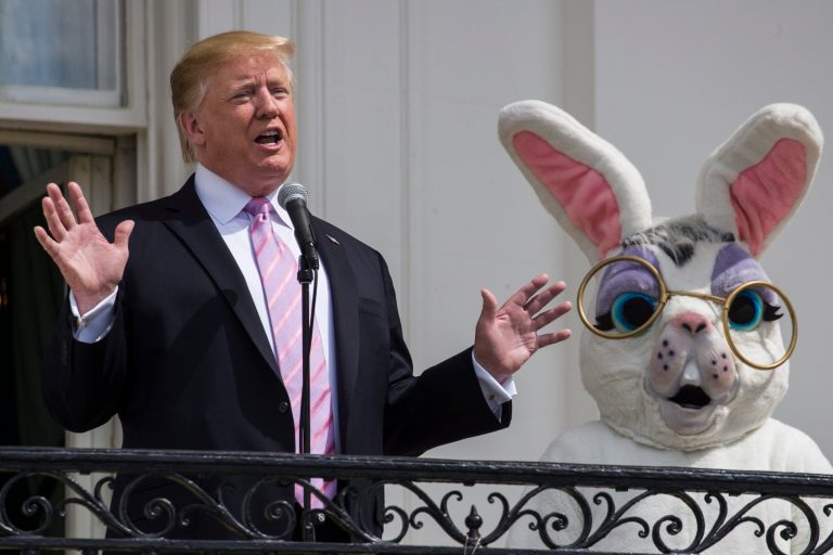 President Donald Trump, joined by the Easter Bunny, on the Truman Balcony of the White House last year. Trump hopes to start putting parts of the country back to work this Easter if the virus subsides.