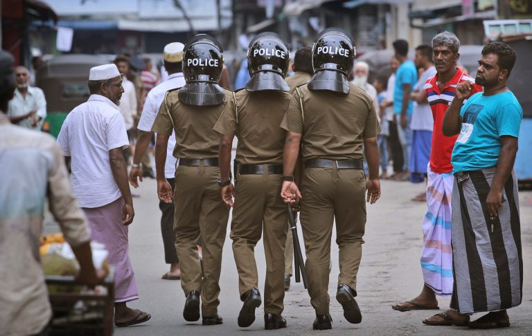 Sri Lankan policeman patrol in a Muslim neighborhood.