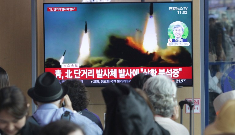 People watch a TV showing a file footage of North Korea's missile launch during a news program at the Seoul Railway Station in Seoul, South Korea, Saturday, May 4, 2019.