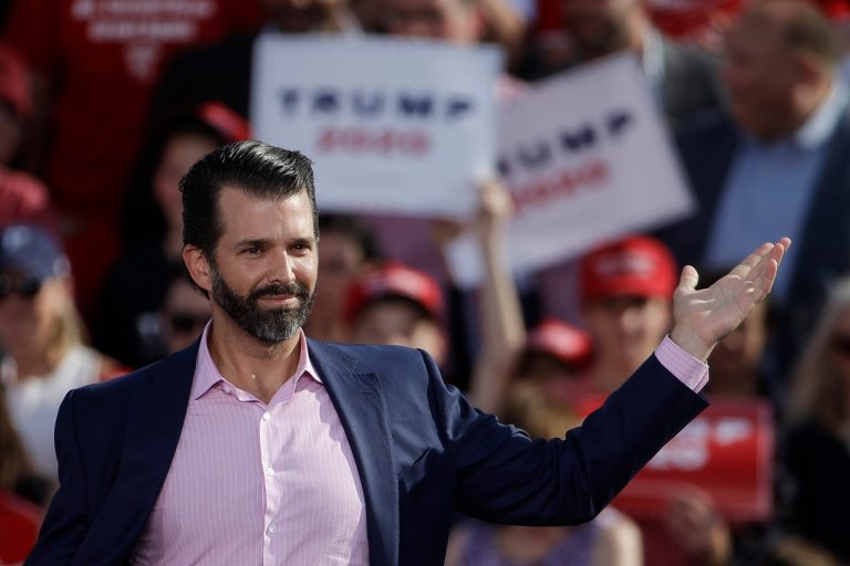 Donald Trump Jr., gestures at a rally for his father. He is urging Republicans to pick up the fight against liberals.