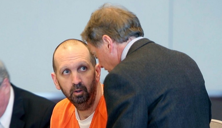 In this March 14, 2017, file photo, Craig Hicks, charged with the murder of three Muslim students in Chapel Hill, N.C., listens to with attorney Steve Freedman as he makes an appearance in a Durham County courtroom in Durham, N.C.