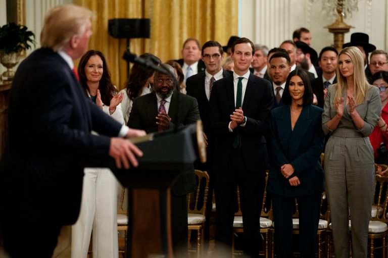 Kim Kardashian West, who is among the celebrities who have advocated for criminal justice reform, stands with White House senior adviser Jared Kushner and Ivanka Trump during an event on second chance hiring and criminal justice reform with President Donald Trump in the East Room of the White House, Thursday, June 13, 2019.