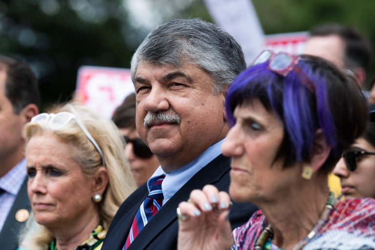 AFL-CIO President Richard Trumka, center, together with Rep. Rosa DeLauro, D-Conn., right, and Rep. Debbie Dingell, D-Mich., at a 2019 event. He isn't saying if he plans to retire, but wants a woman to replace him when he does.