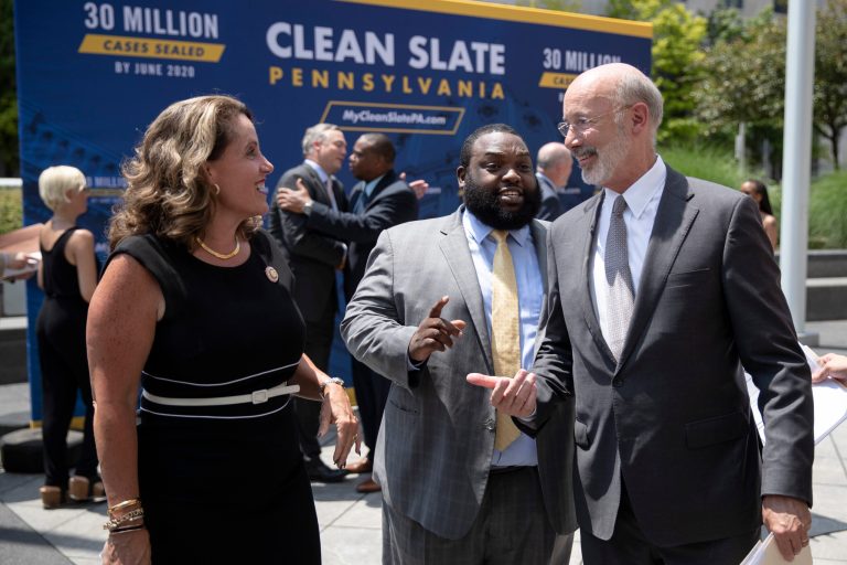 Pennsylvania Gov. Tom Wolf, right, walks with Rep. Sheryl Delozier, R-Cumberland, left, and Rep. Jordan Harris D-Philadelphia, during a news conference in Harrisburg, Pa., Friday, June 28, 2019. (AP Photo/Matt Rourke)