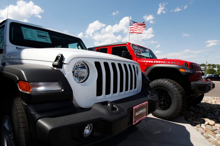 FILE--In this Sunday, July 28, 2019, file photograph, unsold 2019 Jeep Wranglers sit at a dealership in Englewood, Colo. 
