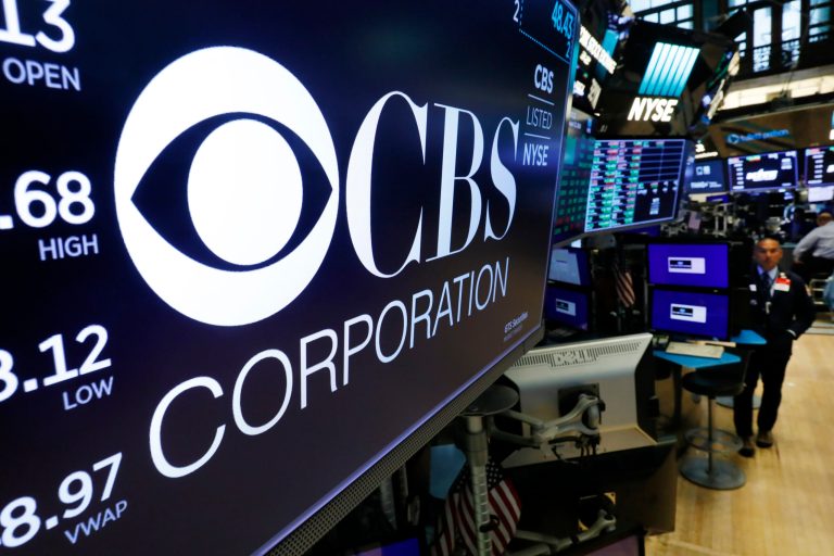The logo for the CBS Corporation appears above a trading post on the floor of the New York Stock Exchange, Tuesday, Aug. 13, 2019.