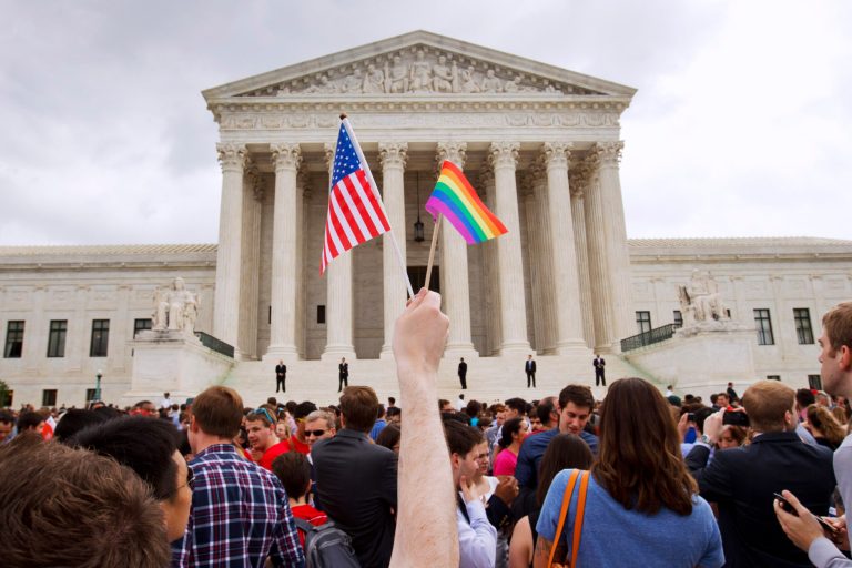 In this June 26, 2015, file photo, a crowd celebrates outside of the Supreme Court in Washington after the court declared that same-sex couples have a right to marry anywhere in the U.S. 