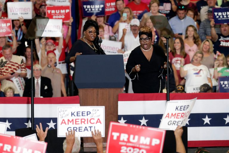 Diamond and Silk take the podium at a rally before President Donald Trump speaks in Fayetteville, N.C., Monday, Sept. 9, 2019.