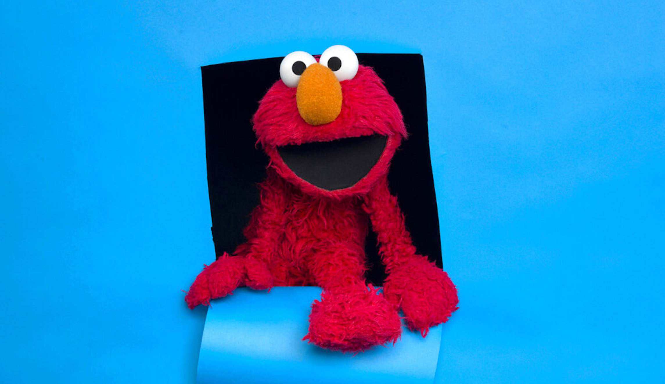 Elmo from Sesame Street helps children cope with separation from military parents, death