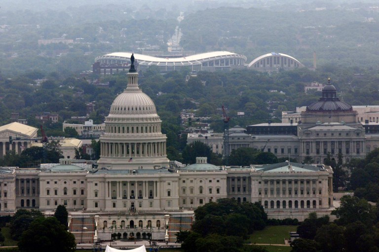 This file photo shows a view of RFK Stadium, background, and the Capitol building, in Washington. 