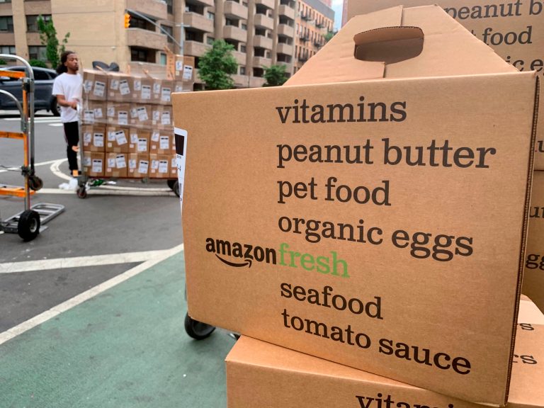 Boxes of Amazon Fresh deliveries are unloaded in New York on June 16, 2019.