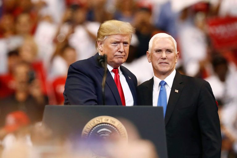 President Donald Trump and Vice President Mike Pence stand together during a campaign rally on Tuesday, Nov. 26, 2019, in Sunrise, Fla. Pence said the administration's fight to slow the coronavirus spread and revive the economy are winning positions.