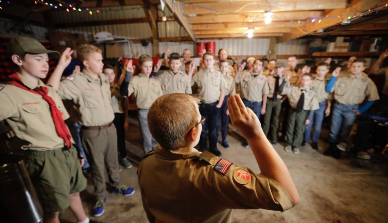In this Thursday, Dec. 12, 2019 photo, a Boy Scouts troop gathers during their meeting, in Kaysville, Utah. 