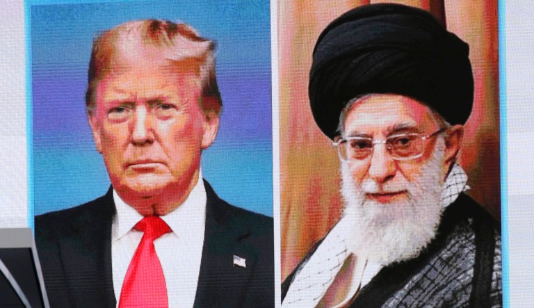 President Trump, left, and Iranian Supreme Leader Ayatollah Ali Khamenei, right, are seen on a TV screen.