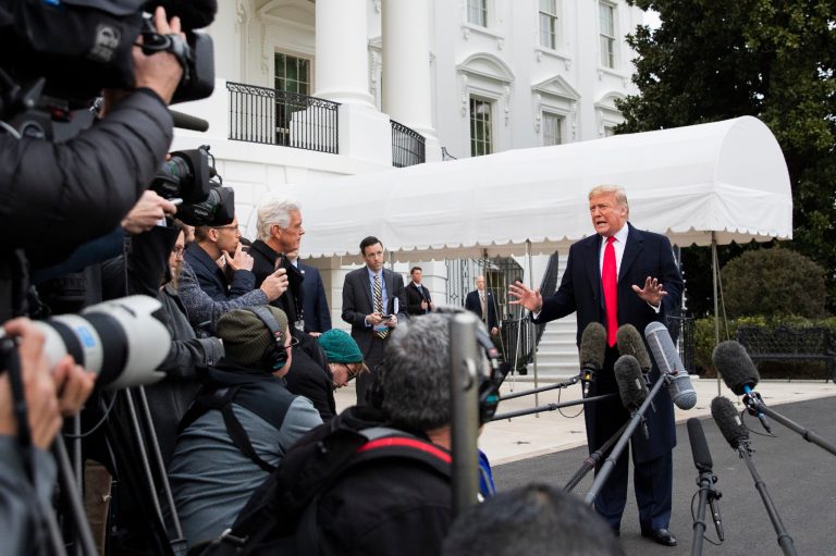 President Donald Trump speaks to the members of the media before leaving the White House, Monday, Jan. 13, 2020, in Washington, for a trip to watch the College Football Playoff national championship game between LSU and Clemson in New Orleans, La.