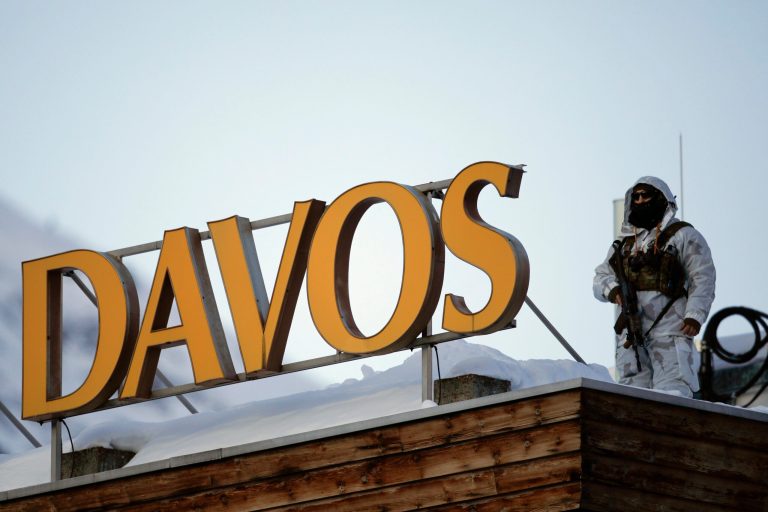 A police security guard patrols on the roof of a hotel ahead of the World Economic Forum in Davos, Switzerland, Monday, Jan. 20, 2020.