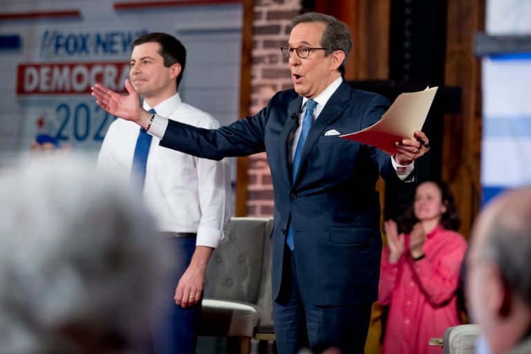 Fox News anchor Chris Wallace, right, speaks at the conclusion of a FOX News Channel Town Hall with Democratic presidential candidate former South Bend, Ind., Mayor Pete Buttigieg, left, at the River Center, Sunday, Jan. 26, 2020, in Des Moines, Iowa.