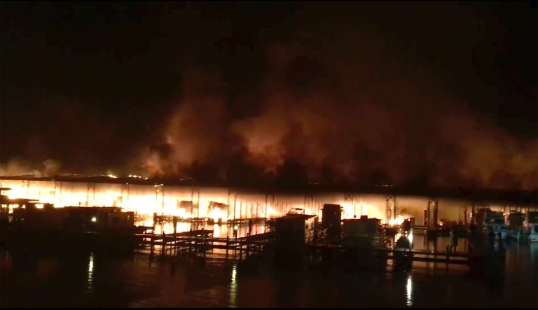 Alabama boathouse fire leaves nine missing and dozens of boats destroyed