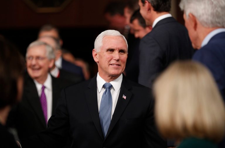 Vice President Mike Pence, center, arrives with Senate Majority Leader Mitch McConnell of Ky., left, before President Donald Trump arrives to deliver his State of the Union address this month. Pence is building up his conservative team.