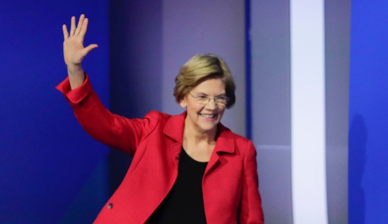 Sen. Elizabeth Warren, D-Mass., waves as she walks on stage Friday, Feb. 7, 2020, before the start of a Democratic presidential primary debate hosted by ABC News, Apple News, and WMUR-TV at Saint Anselm College in Manchester, N.H.