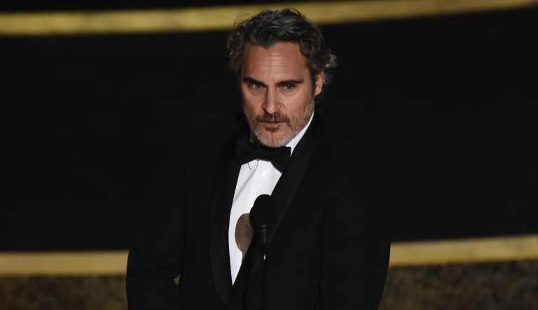 Joaquin Phoenix accepts the award for best performance by an actor in a leading role for "Joker" at the Oscars on Sunday, Feb. 9, 2020, at the Dolby Theatre in Los Angeles.