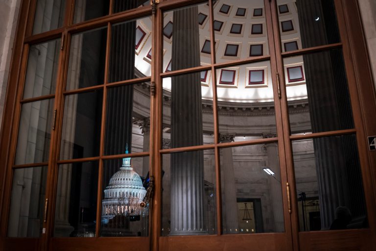 The Capitol is seen amid reflections of the Russell Senate Office Building in Washington. As workers have returned to their offices in Washington, computer porn use has skyrocketed.