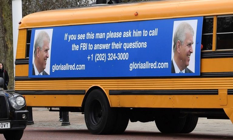 A yellow school bus with a message for the Britain's Prince Andrew, from US lawyer Gloria Allred, drives along The Mall towards Buckingham Palace in London Friday Feb. 21, 2020.