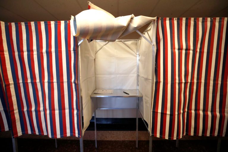 A booth is ready for a voter at City Hall in Cambridge, Mass. Experts are concerned about hack attacks on voter rolls.