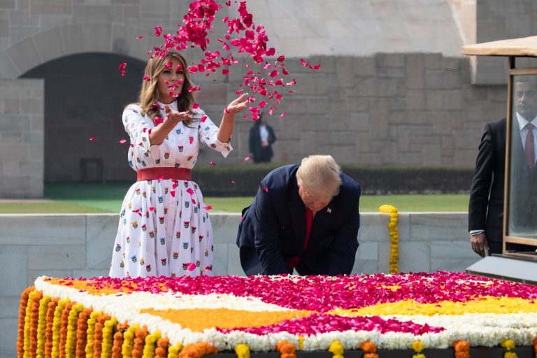 President Trump and first lady Melania Trump offer floral respects at Raj Ghat, the memorial for Mahatma Gandhi, in New Delhi, India, Tuesday, Feb. 25, 2020.
