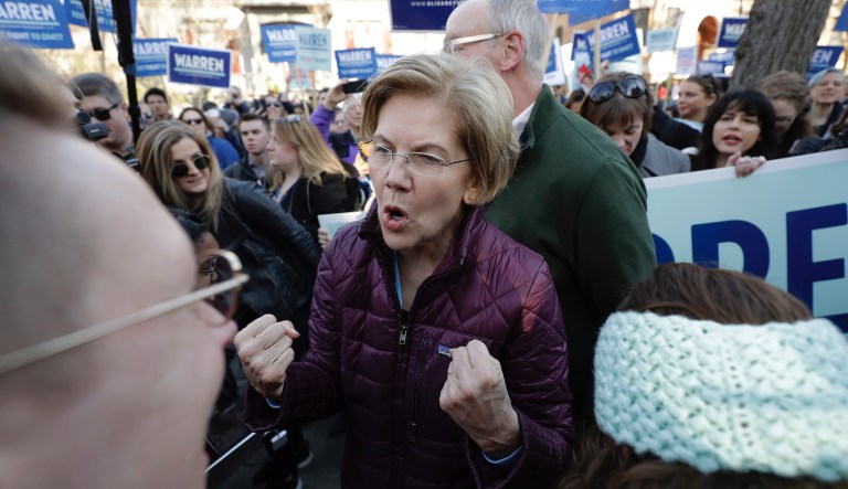 Democratic presidential candidate Sen. Elizabeth Warren, D-Mass., greets supporters as she walks from her home to the nearby polling location to vote on Tuesday, March 3, 2020, in Cambridge, Mass. 