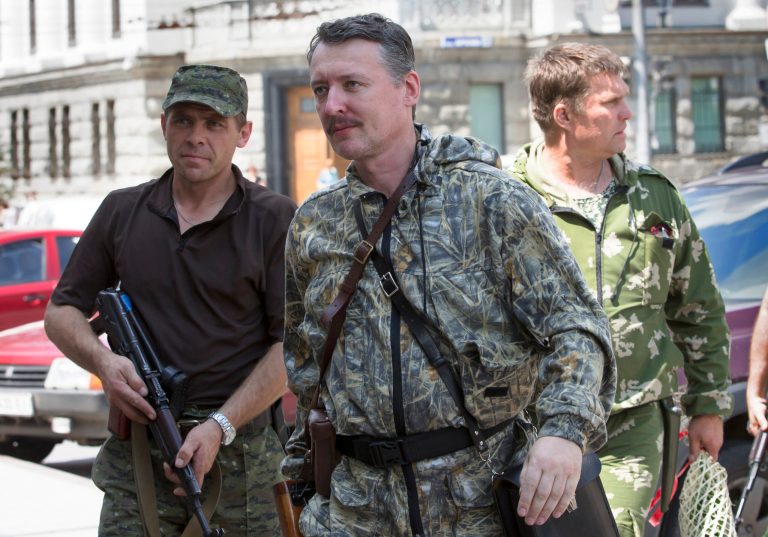 FILE - In this Friday, July 11, 2014 file photo, Igor Girkin also known as Igor Strelkov, a pro-Russian commander, center, arrives for the wedding of platoon commander Arsen Pavlov and Elena Kolenkina in the city of Donetsk, eastern Ukraine.