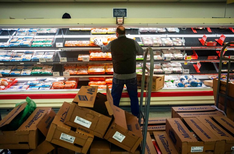 A worker restocks the meat section of a Stop & Shop supermarket during hours open daily only for seniors Thursday, March 19, 2020, in North Providence, R.I. This week grocery store chains and other retailers began offering special shopping hours for seniors and other groups considered the most vulnerable to the new coronavirus. The dedicated shopping times are designed to allow seniors, pregnant women and people with underlying health conditions to shop among smaller crowds and reduce their chances of acquiring the virus. 