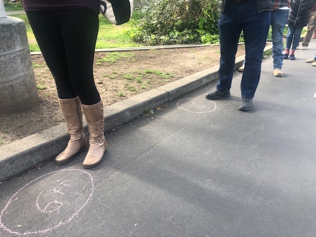 A sidewalk is chalked with a distance of 6 feet for a social distancing to protect from the coronavirus while people wait in line at a farmers market in Oakland's Temescal neighborhood in Oakland, Calif.