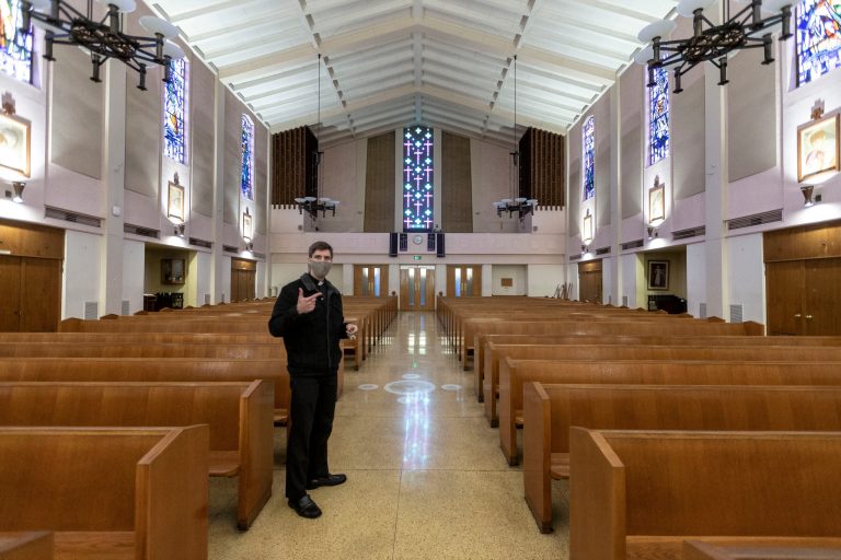 The Rev. Matthew Wheeler of Saint Anthony Parish in San Gabriel, Calif., walks down the empty church, normally packed with the congregation before celebrating the Mass of the Lord's Supper, a Holy Week service celebrated on the evening of Maundy Thursday.