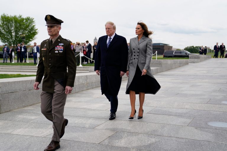 President Donald Trump and first lady Melania Trump arrive to participate in a wreath laying ceremony at the World War II Memorial to commemorate the 75th anniversary of Victory in Europe Day, Friday, May 8, 2020, in Washington.