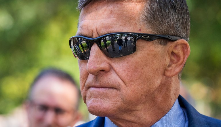 Michael Flynn, President Donald Trump's former national security adviser, leaves the federal court following a status conference with Judge Emmet Sullivan last September. Now the judge is blocking a move by Justice to drop the charges against Flynn.