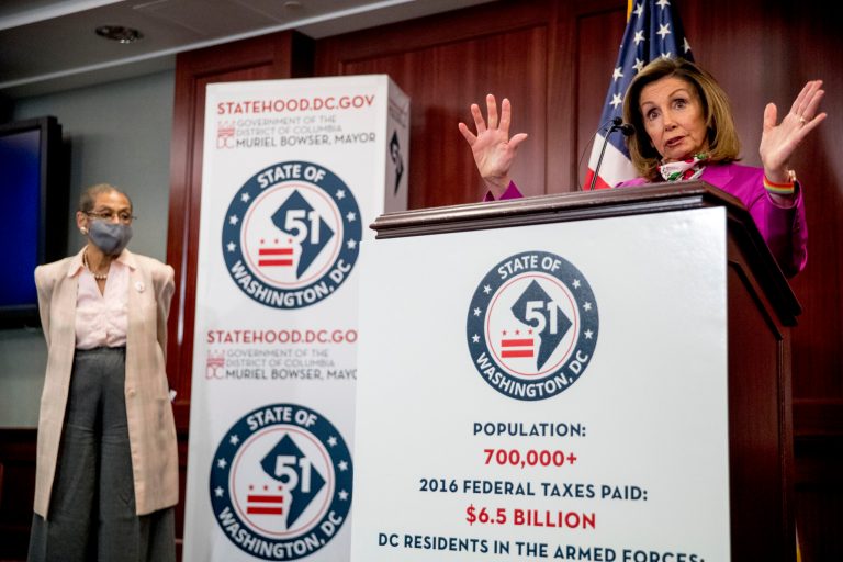 House Speaker Nancy Pelosi of Calif., right, accompanied by Delegate Eleanor Holmes Norton, D-D.C., left, speaks at a news conference on District of Columbia statehood on Capitol Hill, Tuesday, June 16.