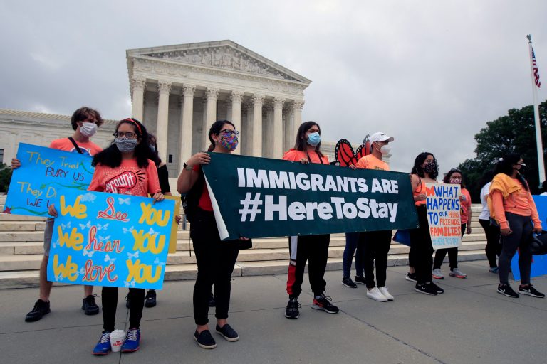 Deferred Action for Childhood Arrivals (DACA) students celebrate in front of the Supreme Court after the Supreme Court rejected President Donald Trump's effort to end legal protections for young immigrants  Thursday.