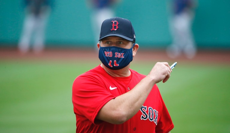 Boston Red Sox special assistant and former player Jason Varitek wears a protective mask to prevent the spread of the coronavirus during baseball practice at Fenway Park in Boston, Friday, July 3, 2020.