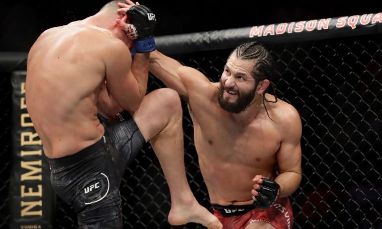 Jorge Masvidal, right, demonstrates his firepower during a UFC bout with Nate Diaz last year. Masvidal, a Cuban-American from Miami, will be campaigning with Donald Trump Jr. in Florida