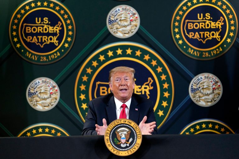 President Donald Trump participates in a border security briefing this year at United States Border Patrol Yuma Station in Yuma, Ariz. New reports show his policies have slashed immigration as he promised to in his 2016 campaign.