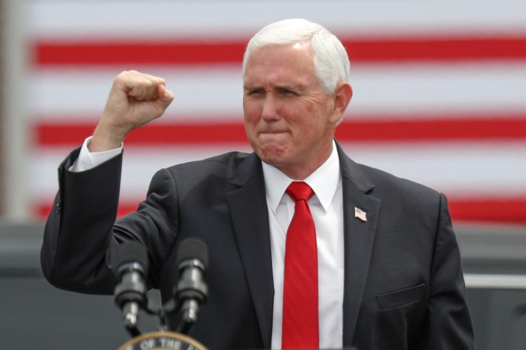 Vice President Mike Pence pumps his fist as he arrives for a "Cops for Trump" campaign event at the police station, Thursday, July 30, 2020, in Greensburg, Pa. Yesterday, in Florida, he became the first vice president to visit a pro-life pregnancy clinic.