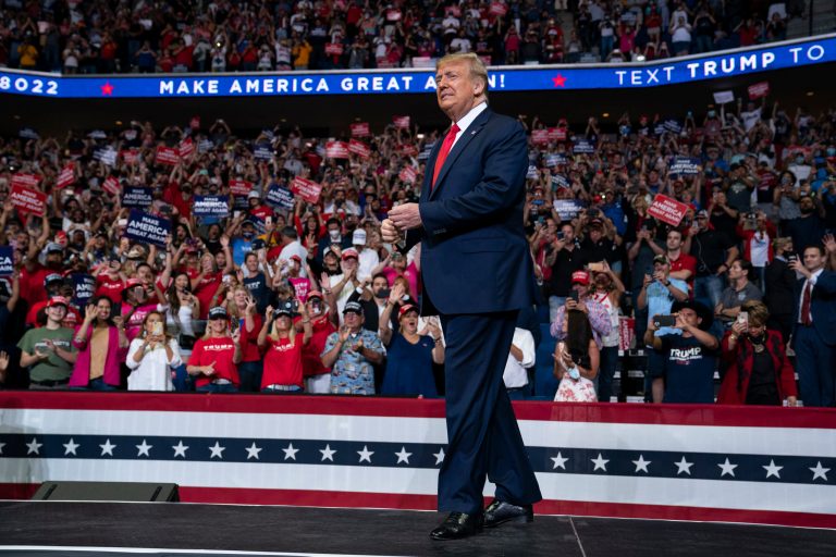 In this June 20, 2020, file photo President Donald Trump arrives on stage to speak at a campaign rally at the BOK Center in Tulsa, Okla. Trump is privately reassuring Republicans anxious about his deficits to Democrat Joe Biden.
