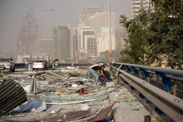 Aftermath of a massive explosion is seen in in Beirut, Lebanon, Tuesday, Aug. 4, 2020. Massive explosions rocked downtown Beirut on Tuesday, flattening much of the port, damaging buildings and blowing out windows and doors as a giant mushroom cloud rose above the capital. Witnesses saw many people injured by flying glass and debris.