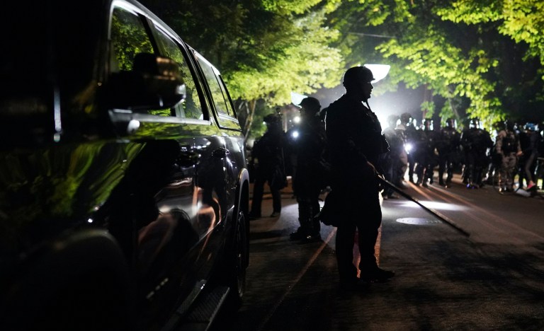 Riot declared after Portland protesters set police union building on fire