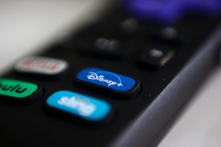 This Aug. 13, 2020, photo shows logos for Netflix, Hulu, Disney+, and Sling TV on a remote control in Portland, Oregon. 